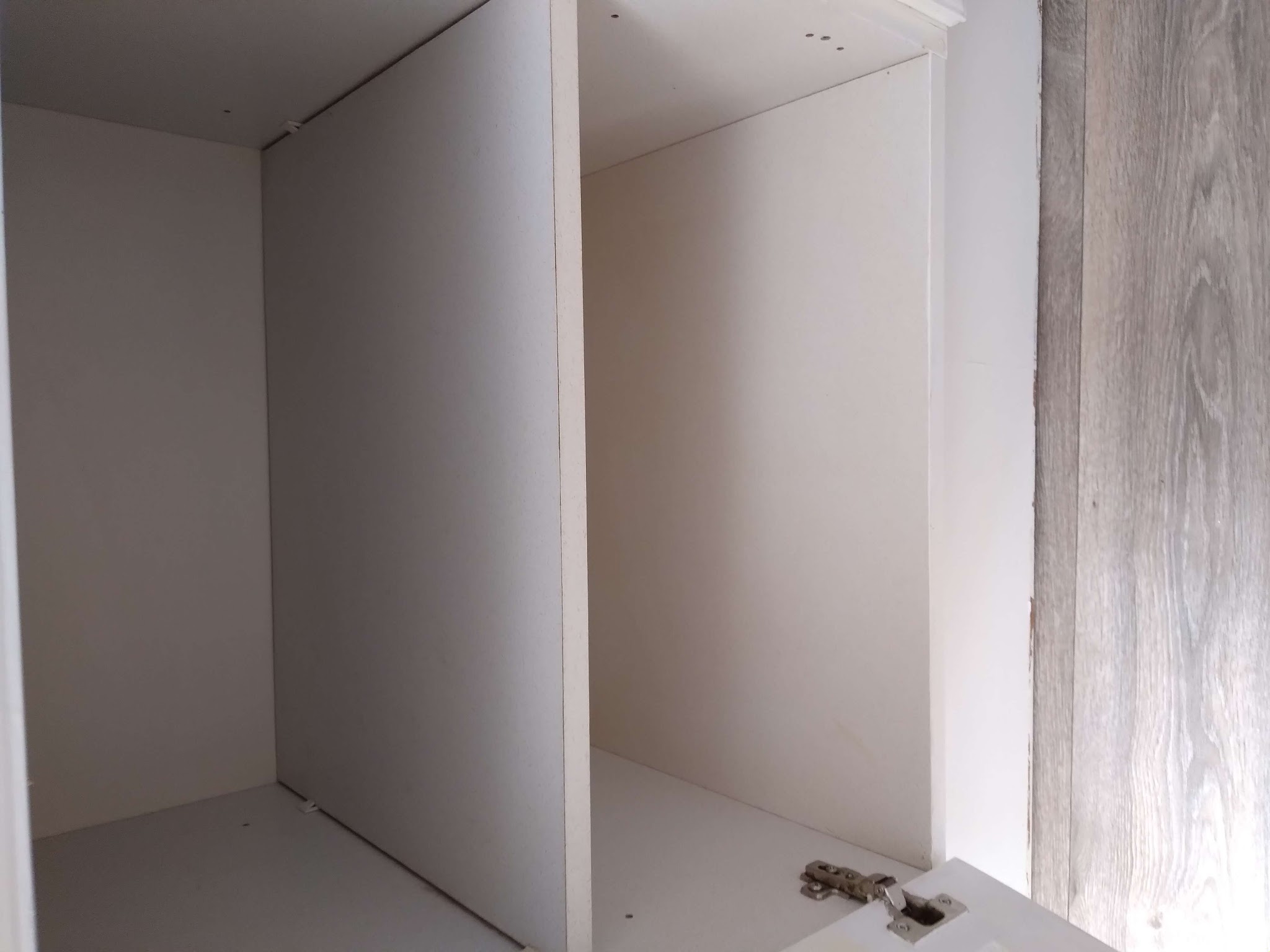 An empty white wardrobe, cleaned inside
